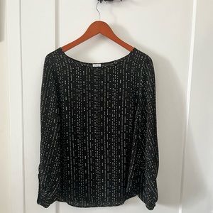 Black with white shirt, sleeves are open to show arms. Great summer shirt.